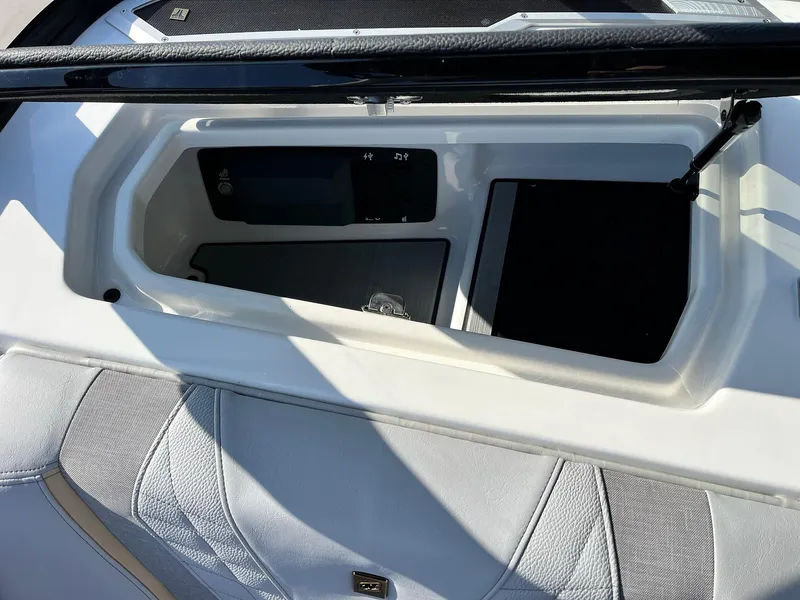 Slide: The Image of 2024 Nautique G25 storage compartment with sleek design and modern features. - 28