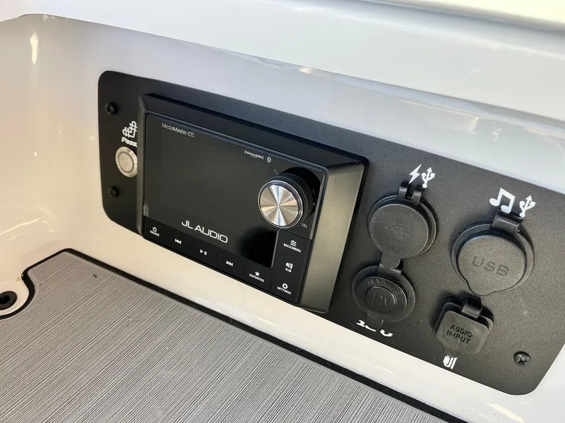 Slide: The Image of 2024 Nautique G25 JL Audio system with USB and auxiliary ports. - 29