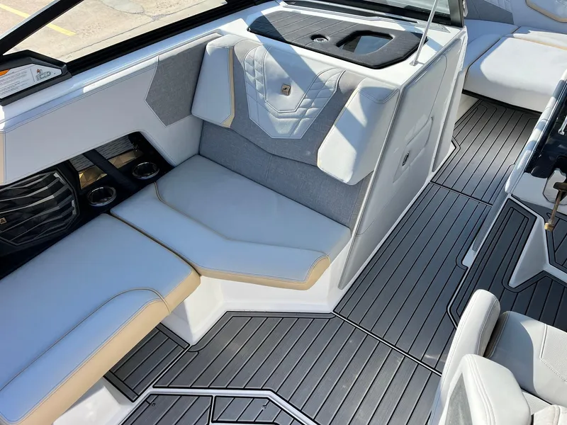 Slide: The Image of 2024 Nautique G25 boat interior with sleek seating and modern design. - 30