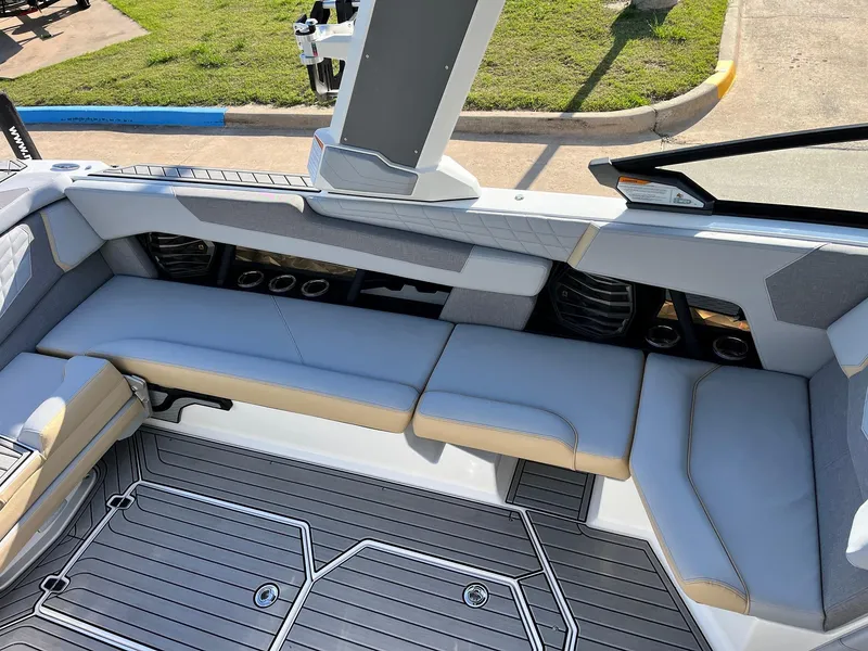 Slide: The Image of 2024 Nautique G25 boat interior with sleek seating and modern design. - 35