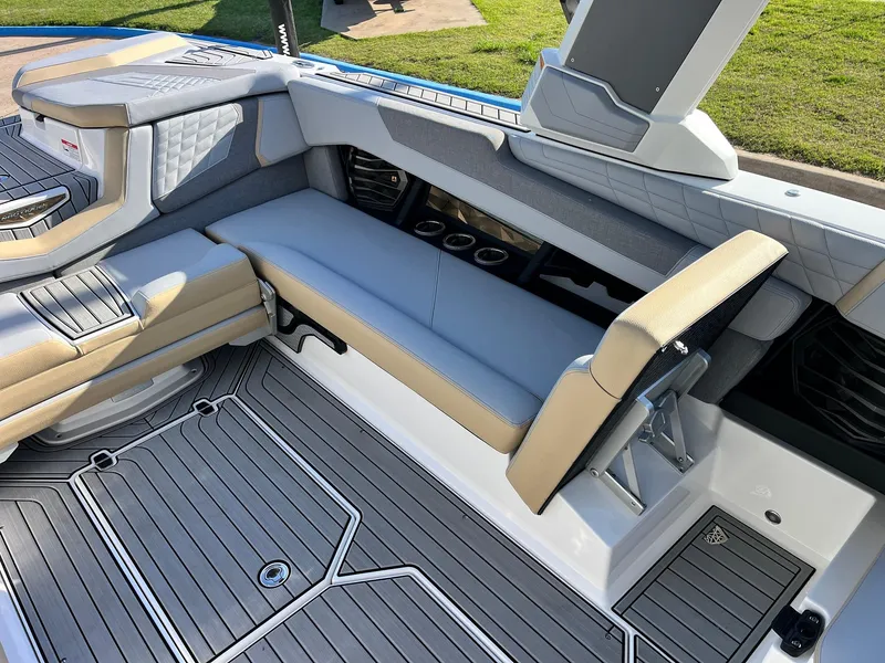 Slide: The Image of 2024 Nautique G25 boat interior with luxurious seating and modern design. - 36