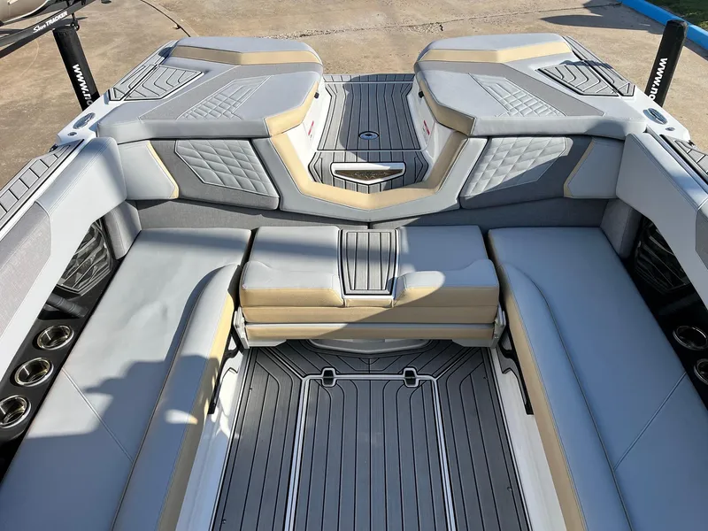Slide: The Image of 2024 Nautique G25 boat interior with luxurious seating and modern design. - 43