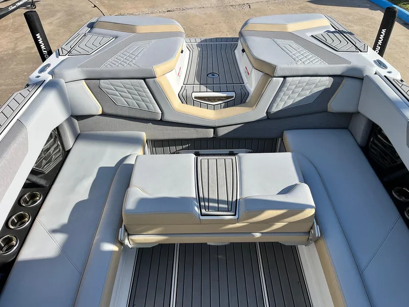 Slide: The Image of 2024 Nautique G25 boat interior with luxurious seating and modern design. - 44