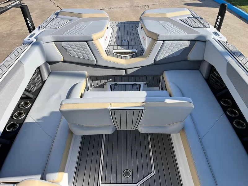 Slide: The Image of 2024 Nautique G25 boat interior with luxurious seating and modern design. - 45