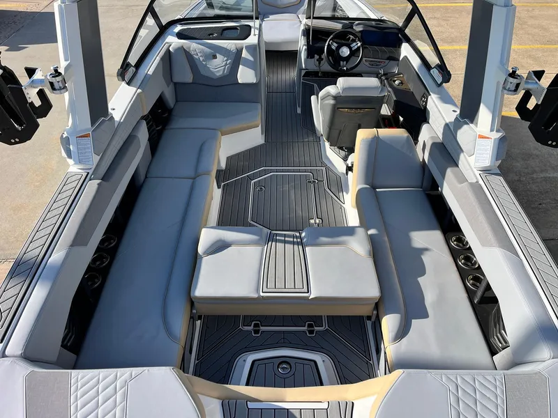 Slide: The Image of 2024 Nautique G25 boat interior with sleek seating and modern design. - 47