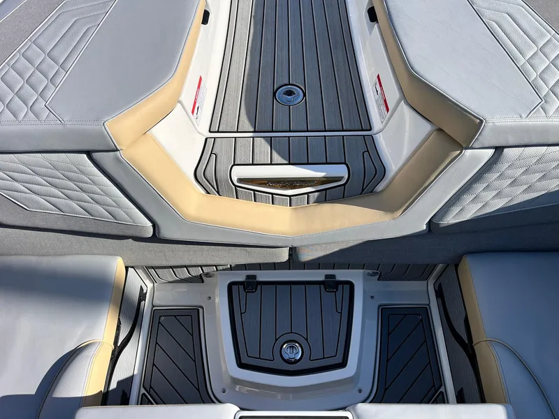 Slide: The Image of 2024 Nautique G25 boat interior with sleek, modern design and premium upholstery. - 48