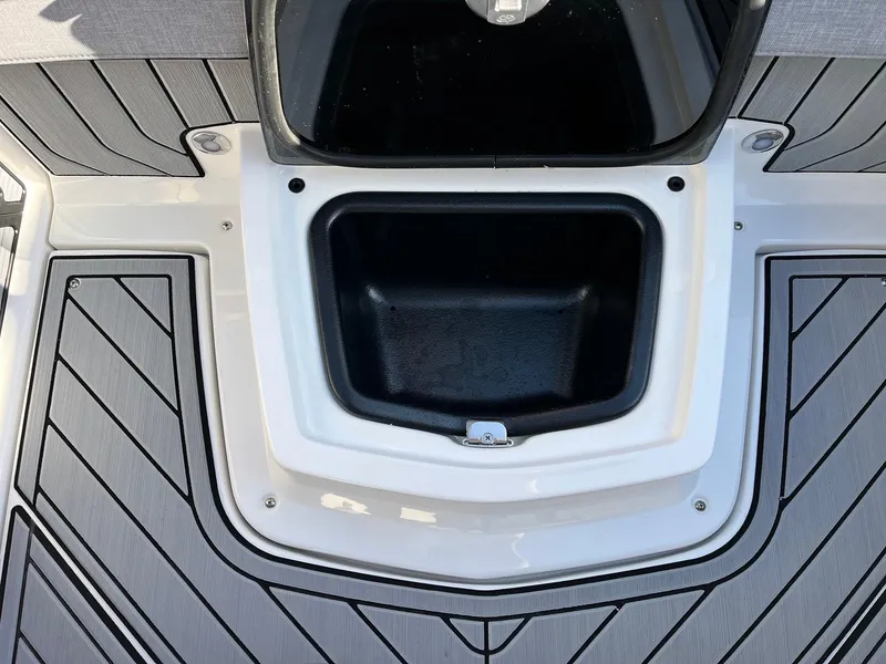 Slide: The Image of 2024 Nautique G25 boat storage compartment with sleek design and durable materials. - 49