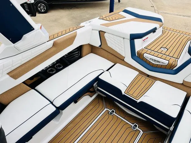 Slide: The Image of 2024 Nautique G23 boat interior with luxurious seating and stylish design. - 20