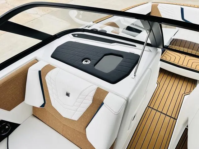 Slide: The Image of 2024 Nautique G23 boat interior with luxurious seating and sleek design. - 22