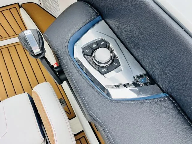 Slide: The Image of 2024 Nautique G23 boat control panel with sleek design and modern features. - 45