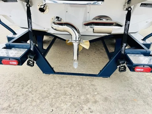 Slide: The Image of 2024 Nautique G23 boat trailer with propeller and exhaust system. - 9