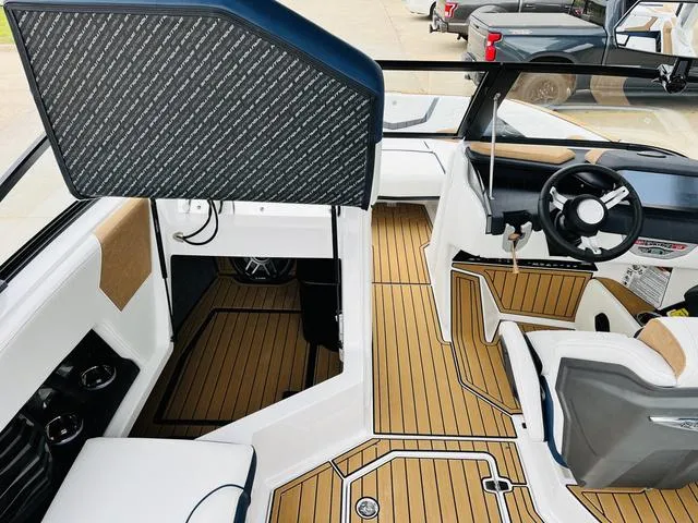 Slide: The Image of 2024 Nautique G23 boat interior with sleek design and modern dashboard. - 25