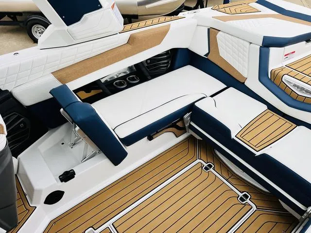 Slide: The Image of 2024 Nautique G23 boat interior with luxurious seating and stylish design. - 41