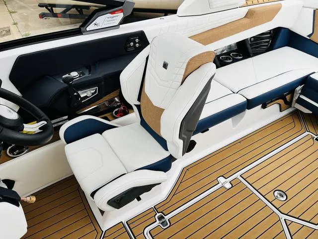 Slide: The Image of 2024 Nautique G23 boat interior with luxurious seating and modern design. - 45
