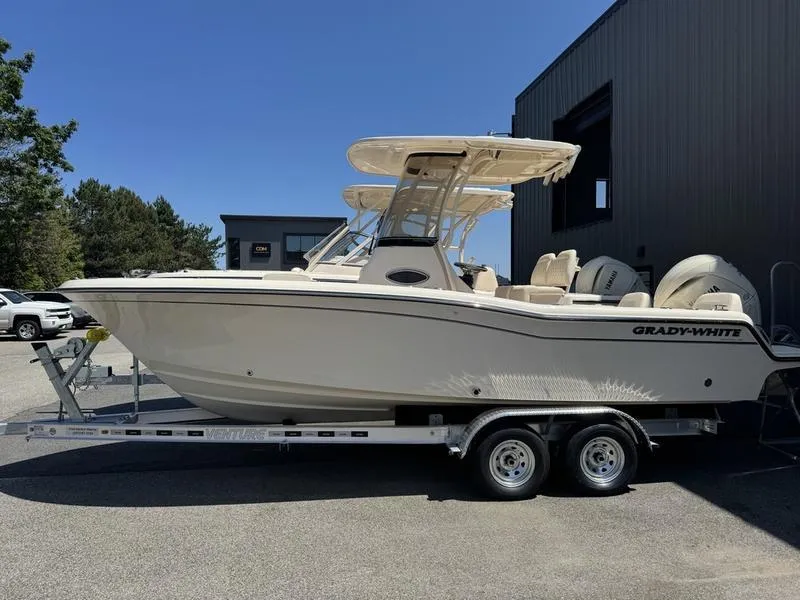 Slide: The Image of 2025 Grady-White Fisherman 216 boat on trailer, parked outdoors. - 1