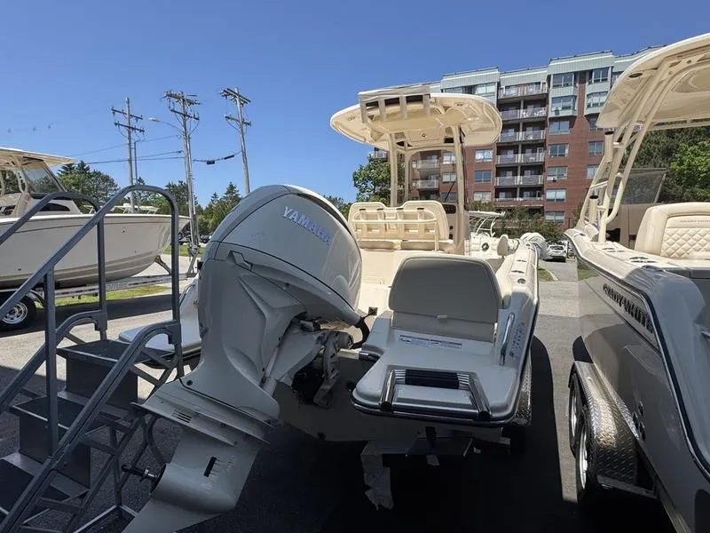 Slide: The Image of 2025 Grady-White Fisherman 216 boat with Yamaha engine, displayed outdoors. - 4