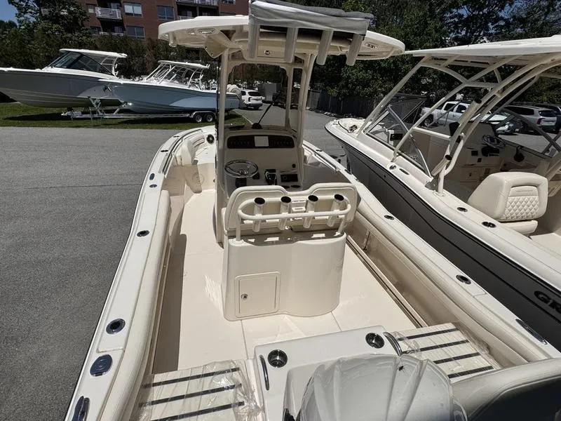 Slide: The Image of 2025 Grady-White Fisherman 216 boat interior with console and seating. - 5