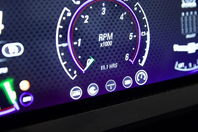 Slide: The Image of 2024 Malibu 23 LSV dashboard displaying RPM gauge and indicators. - 10