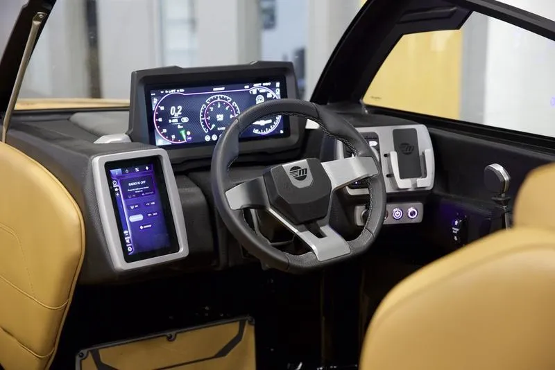 Slide: The Image of 2024 Malibu 23 LSV boat dashboard with modern controls and digital displays. - 12