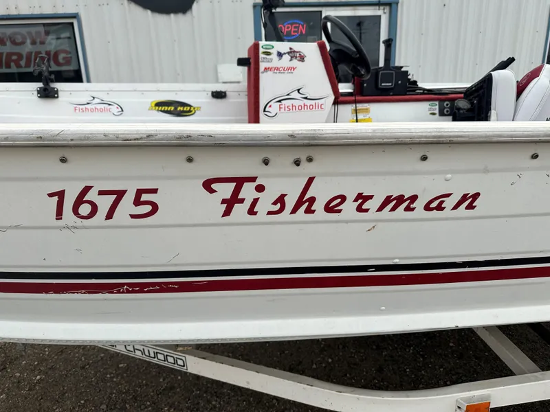 Slide: The Image of 1995 Northwood 1675 Fisherman boat with red lettering on the side. - 11