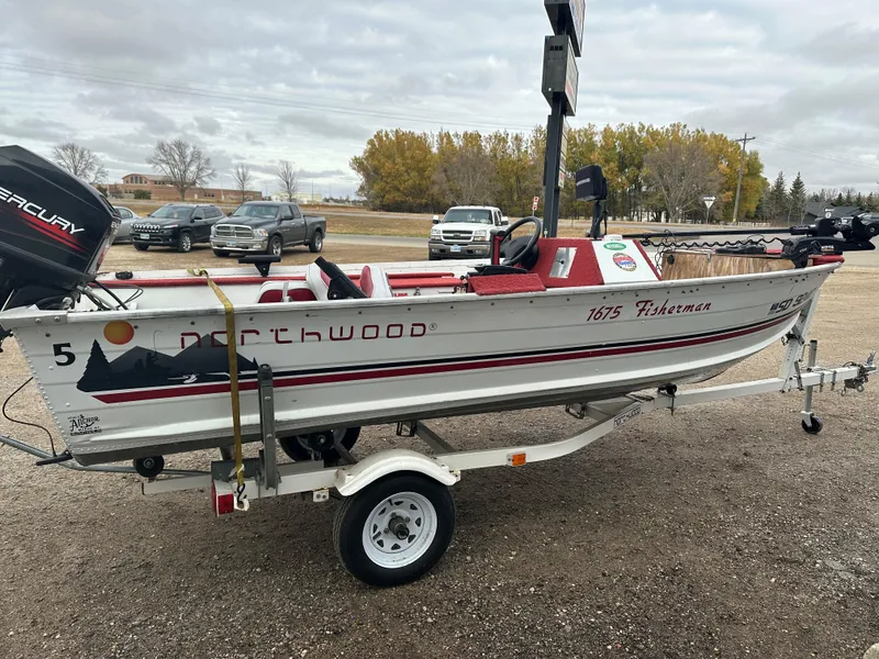Slide: The Image of 1995 Northwood 1675 Fisherman boat on trailer, parked outdoors. - 3