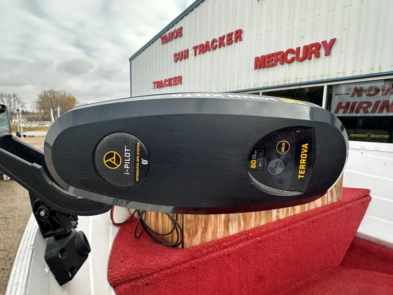 Slide: The Image of Minn Kota Terrova motor on 1995 Northwood 1675 Fisherman boat, dealership background. - 4