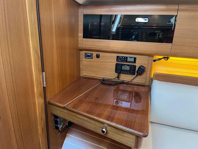 Slide: The Image of 2025 Catalina 386 yacht interior with navigation station and control panel. - 17