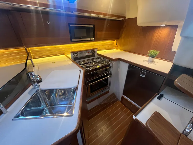 Slide: The Image of Modern kitchen in 2025 Catalina 386 yacht with sleek countertops and stainless steel appliances. - 19