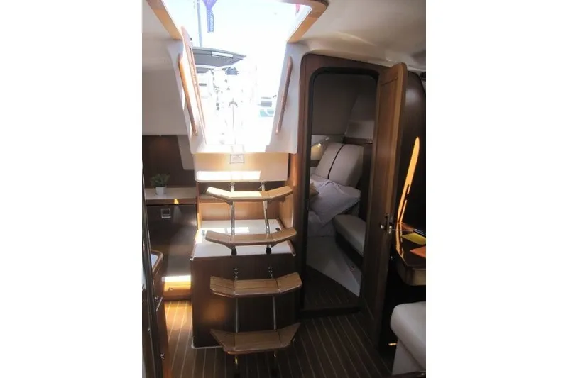 Slide: The Image of Interior of 2025 Catalina 386 yacht with wooden steps and cozy cabin. - 35