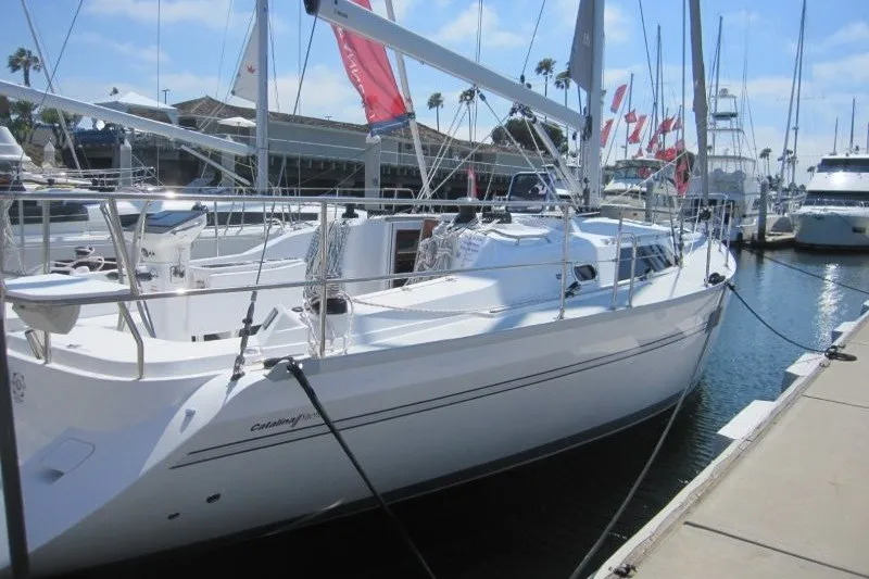 Slide: The Image of 2025 Catalina 386 sailboat docked at marina under clear blue sky. - 37