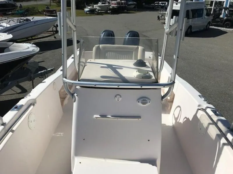 Slide: The Image of 2021 Grady-White 257 Fisherman boat, center console view, parked in a marina. - 12