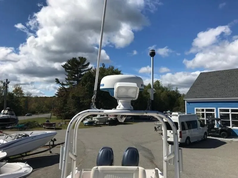 Slide: The Image of Grady-White 257 Fisherman 2021 boat radar and antenna under blue sky. - 13