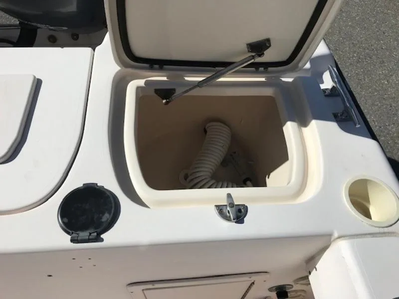 Slide: The Image of Open storage compartment on 2021 Grady-White 257 Fisherman boat. - 17