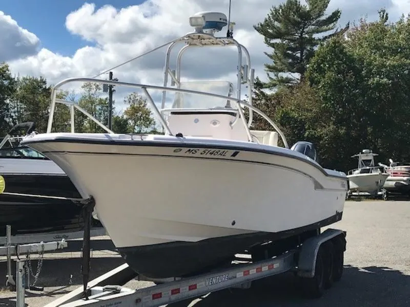 Slide: The Image of 2021 Grady-White 257 Fisherman boat on trailer, parked outdoors. - 2