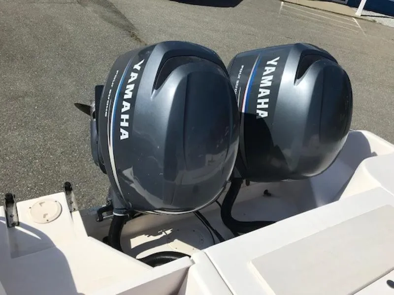Slide: The Image of Twin Yamaha outboard motors on a 2021 Grady-White 257 Fisherman boat. - 8