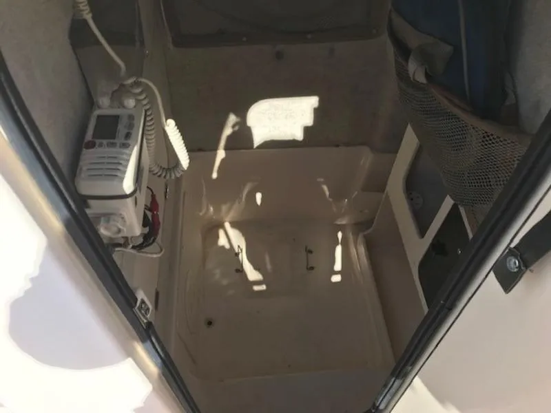 Slide: The Image of Interior of 2021 Grady-White 257 Fisherman boat, featuring a compact cabin space. - 9