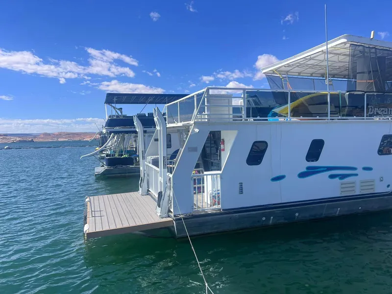 Slide: The Image of Houseboat on water, Fun Country model, 1993, under clear blue sky. - 2