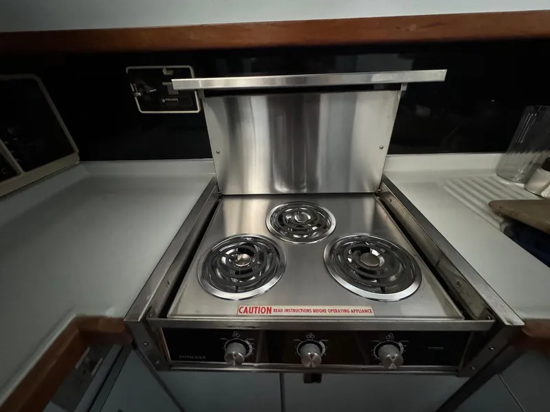 Slide: The Image of Stainless steel stove in 1988 Sea Ray 345 Sedan Bridge yacht kitchen. - 10