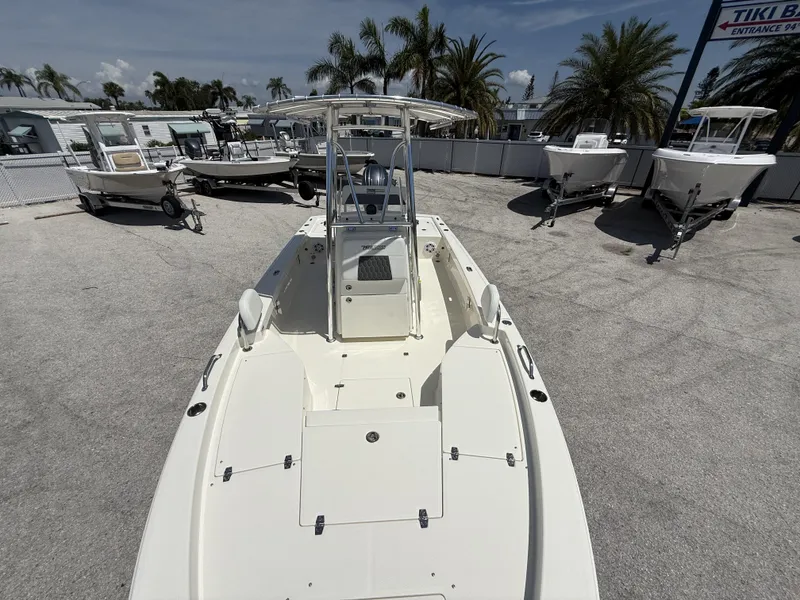 Slide: The Image of 2025 Pathfinder 2200 TRS boat displayed outdoors with palm trees in the background. - 14