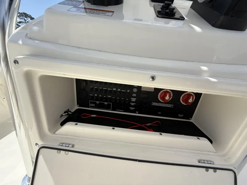 Slide: The Image of 2025 Pathfinder 2200 TRS boat control panel with switches and wiring. - 19