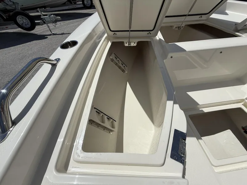 Slide: The Image of Open storage compartment on a 2025 Pathfinder 2200 TRS boat, showcasing spacious interior. - 20