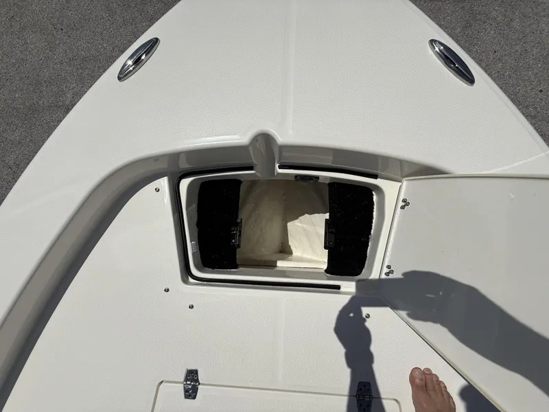 Slide: The Image of Open storage compartment on 2025 Pathfinder 2200 TRS boat deck. - 21