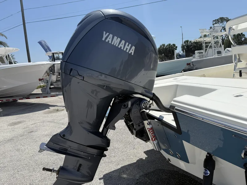 Slide: The Image of Yamaha outboard motor on 2025 Pathfinder 2200 TRS boat, parked outdoors. - 24