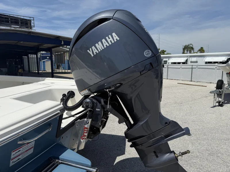 Slide: The Image of Yamaha outboard motor on 2025 Pathfinder 2200 TRS boat, parked outdoors. - 25