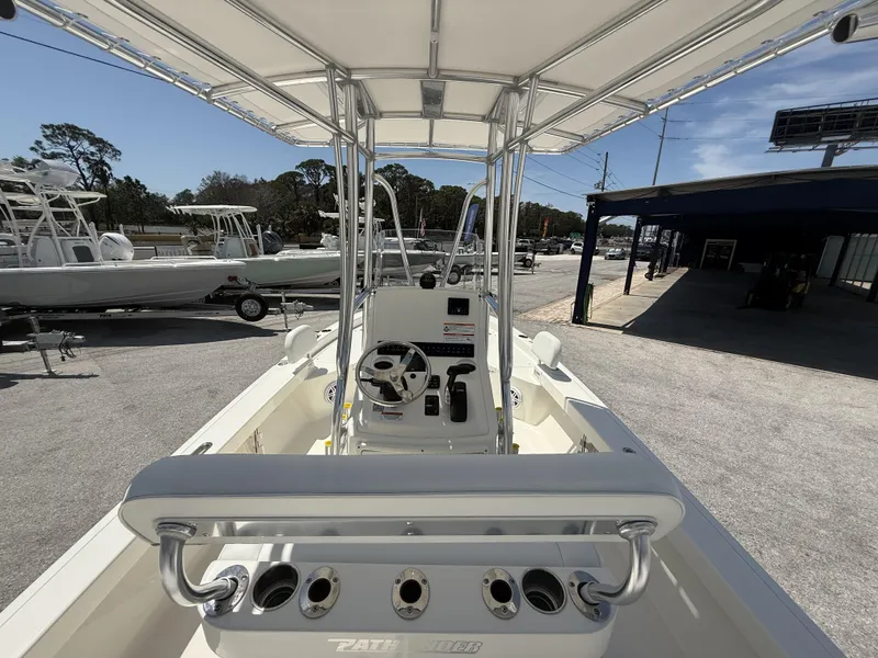 Slide: The Image of 2025 Pathfinder 2200 TRS boat interior with steering console and rod holders. - 26