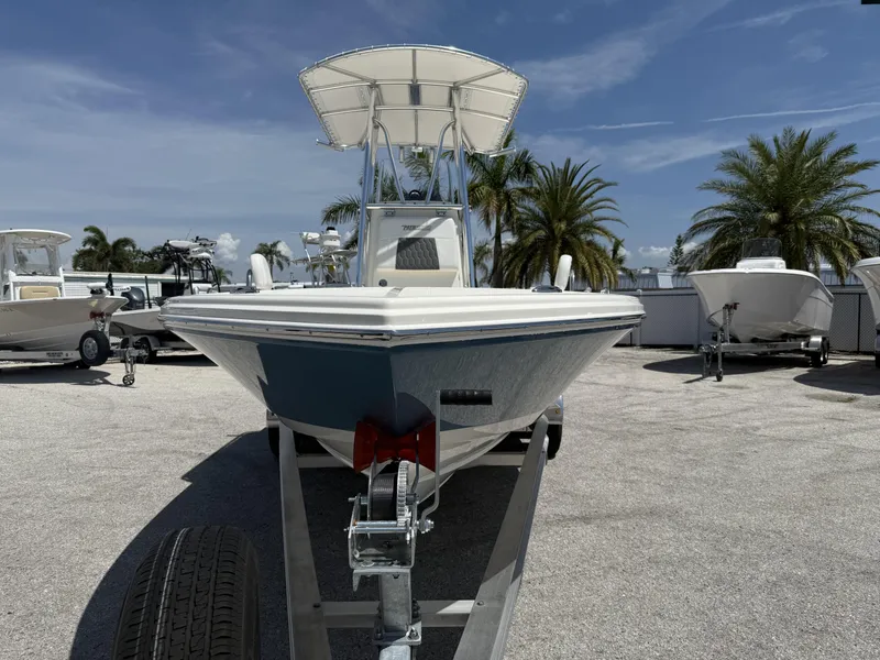 Slide: The Image of 2025 Pathfinder 2200 TRS boat on trailer, sunny day, palm trees in background. - 7