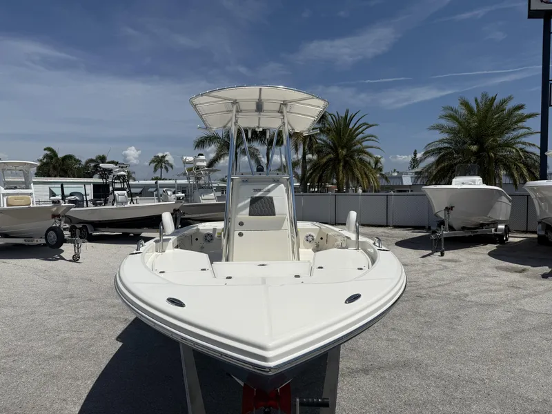 Slide: The Image of 2025 Pathfinder 2200 TRS boat displayed outdoors with palm trees in the background. - 8