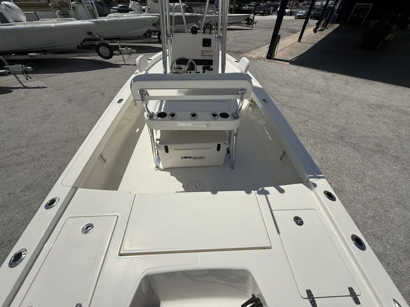 Slide: The Image of 2025 Pathfinder 2200 TRS boat interior with seating and console, displayed outdoors. - 9