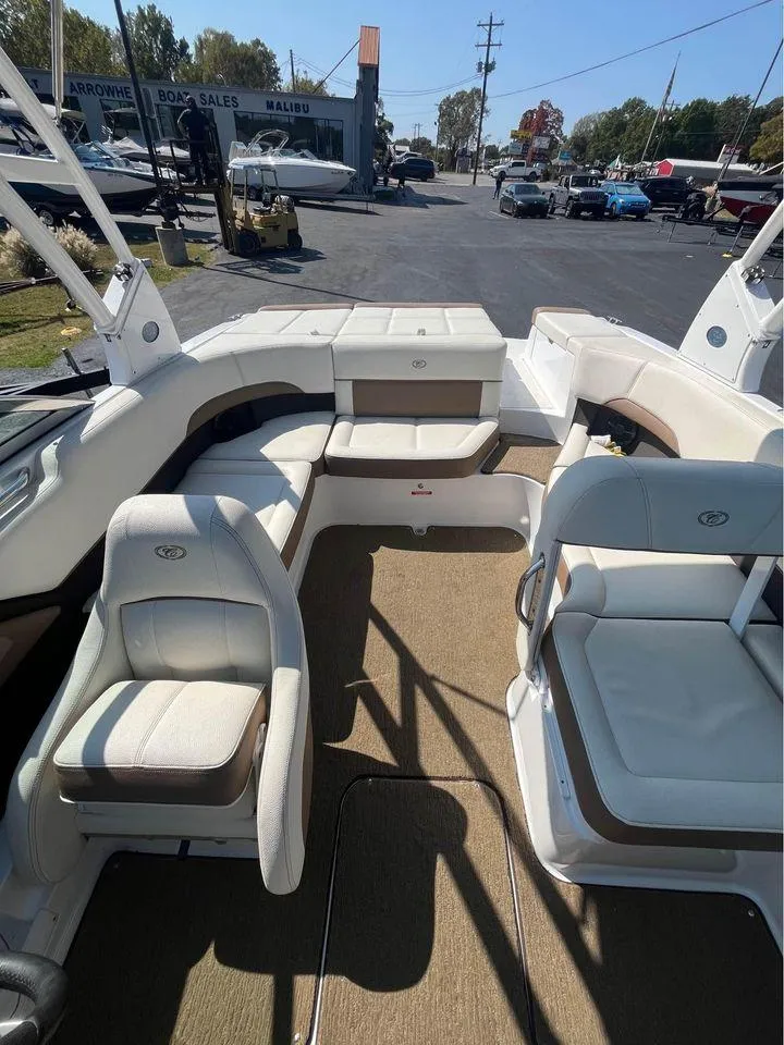 Slide: The Image of 2017 Cobalt 220S boat interior with white seating and carpeted floor. - 6