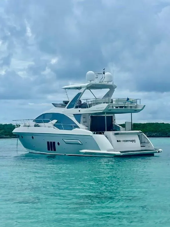 The Image of 2015 Azimut 50 yacht on turquoise water under cloudy sky. - 0